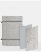 Grey linen fabric notebook with elastic closure and waterproof cover detail
