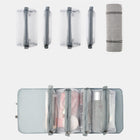 Set of grey transparent mesh travel toiletry bags and a matching storage roll