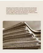 Stacked layers of thick, high-quality beige leather sheets showcasing texture and thickness