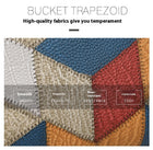 Close-up of multi-colored textured leather fabric with stitching and quality labels.