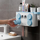 Blue and white wall-mounted toothbrush holder and bathroom organizer with toothpaste dispenser.