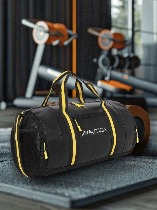 Black and yellow Nautica gym duffel bag placed in a fitness center gym setting