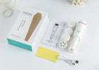 Multifunctional facial cleansing brush kit with replaceable heads and USB charging cable.