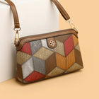 Multi-colored patchwork crossbody bag with geometric pattern and gold hardware