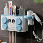 White wall-mounted bathroom organizer holding skincare bottles and a hair dryer.