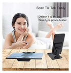 Detachable desk type phone holder stand for hands-free mobile viewing.