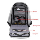 Open grey backpack showing compartments for a phone, camera, iPad, and laptop computer.