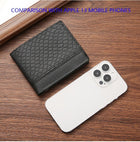 Black textured leather wallet next to a white smartphone on a wooden surface.
