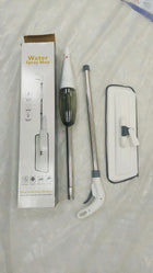 Water spray mop disassembled with packaging box on a white plastic surface