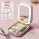 Pink portable makeup organizer case with built-in LED mirror and makeup storage