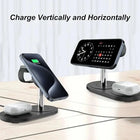 Black wireless charging station charging a smartphone vertically and horizontally.