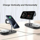 Black wireless charging station charging a smartphone vertically and horizontally.